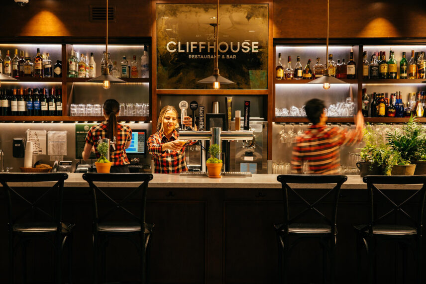 server pouring beer at the cliff house restaurant bar capilano suspension bridge park
