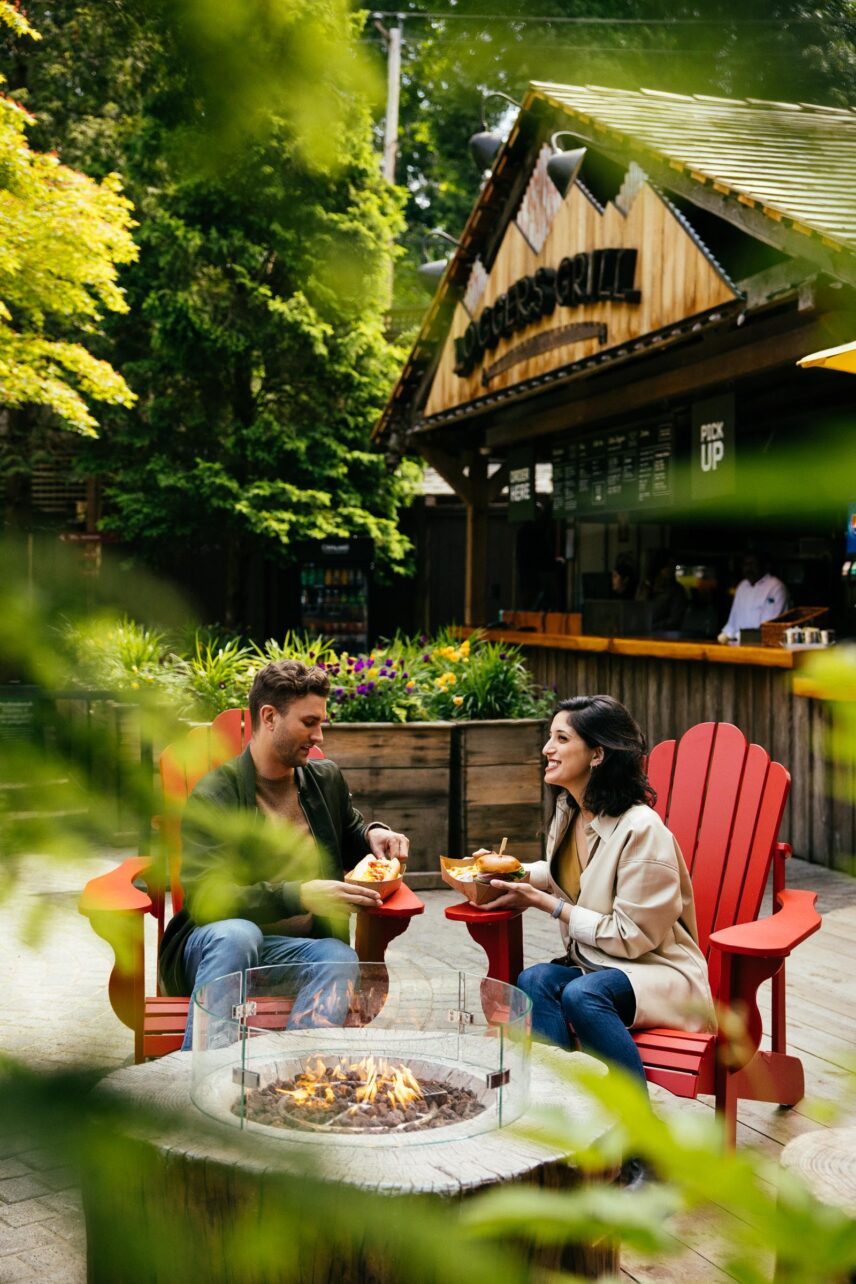couple eating burgers at loggers' grill at Capilano Suspension Bridge Park